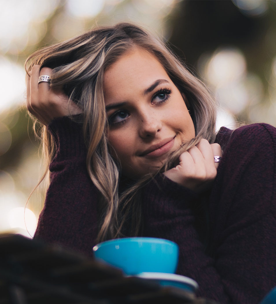 Young woman leaning on table