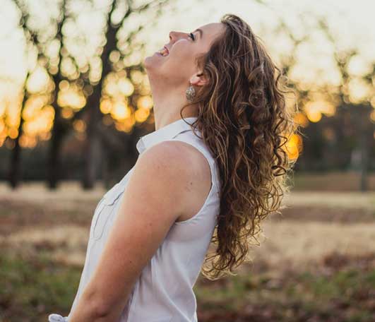 Woman Leaning Back Laughing